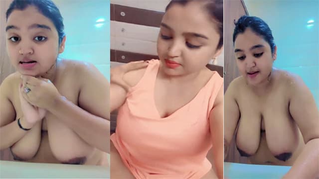 Desi Lady big boobs showing while bathing